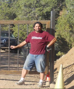 Mark Madrid standing by a finished gate