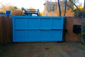solar powered automatic blue painted wooden gate exterior