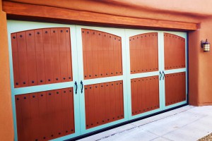 Ranch style red wood and blue paneled garage double doors