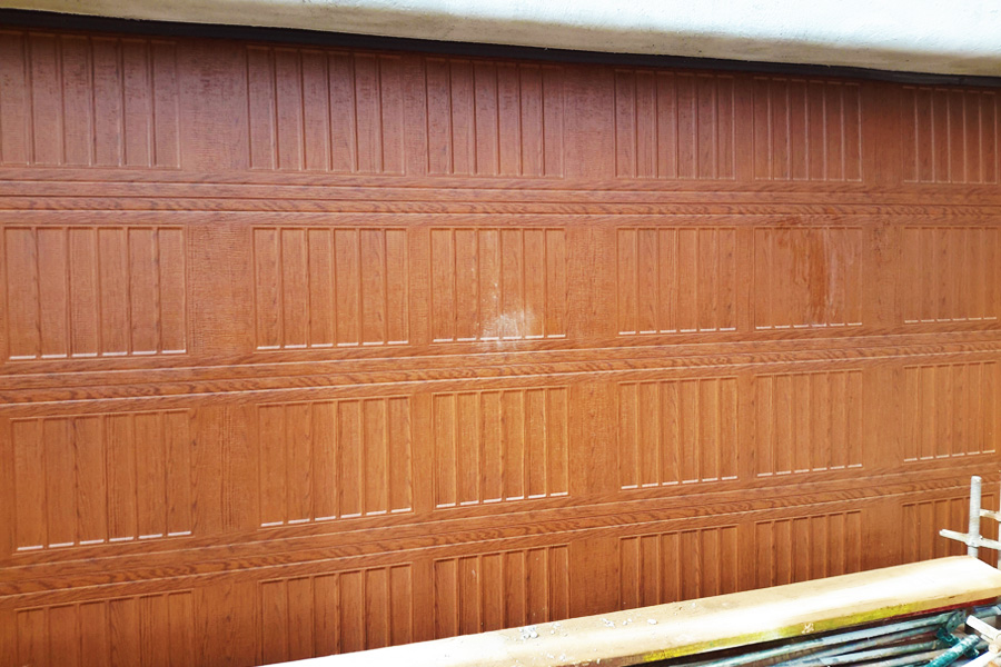 wood paneled garage door progress shot