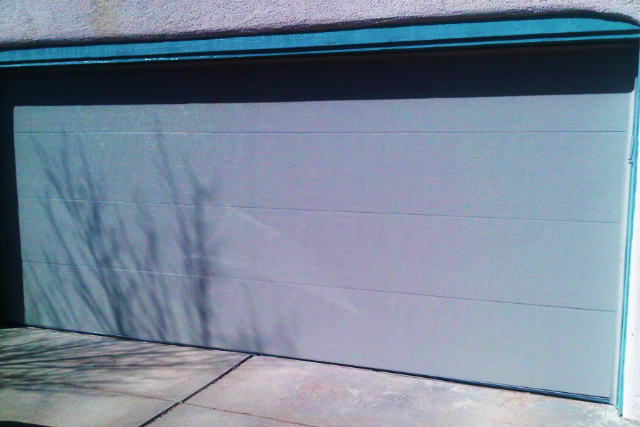 wide garage door on stucco house