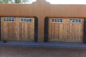 progress shot of two door garage with wooden panels and windows