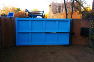 solar powered automatic blue painted wooden gate exterior